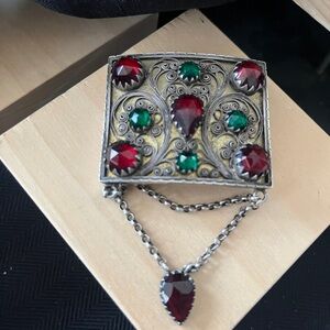 Vintage-Inspired Silver Brooch with Red and Green Accents
